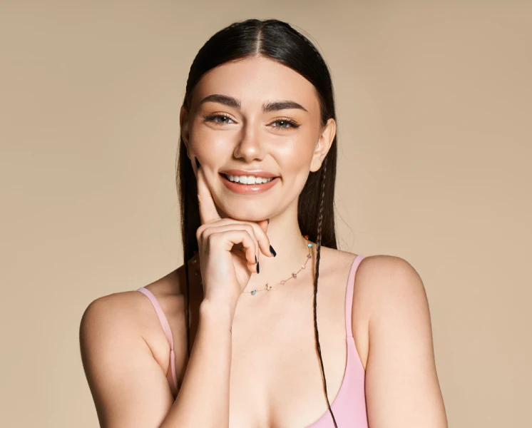 Woman with smooth, glowing skin, ready to book a laser appointment at Laser & More Clinic Dubai
