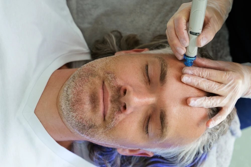 Facial treatment device being used on a client during a HydraFacial-style treatment